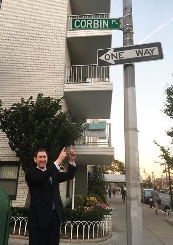 Councilman Chaim Deutsch at the street sign