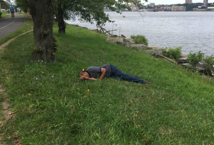 Akhmedov is pictured on the ground after being discovered by a jogger three days after disappearing. (NYPD