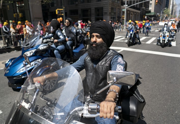 Members of the Sikh Motorcycle Club Of The Northeast ride along Madison Ave. during the Sikh Day Parade, an annual Nagar Keertan "meditation celebration" Saturday, April 28, 2018, in New York. (AP Photo/Craig Ruttle)