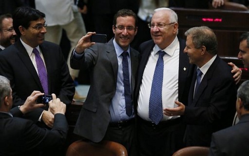 Selfie time! Knesset member Itzik Shmuli holds the camera as he takes a selfie with Reuven Rivlin, center, and Meir Sheetrit during Tuesday's presidential voting (Miriam Alster/FLASH90)