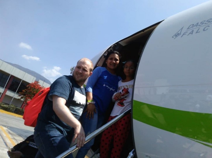 In this image provided by the Holt family, Joshua Holt, his wife Thamara and her daughter Marian Leal, board a plane at the airport in Caracas, Venezuela, Saturday, May 26, 2018. AP