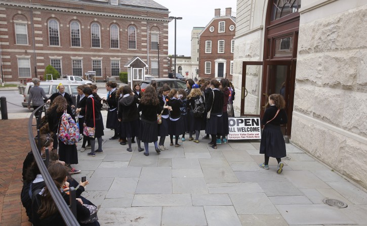 In this Thursday, May 28, 2015 photo, Orthodox Jewish school girls gather outside the visitor's center at the Touro Synagogue during a tour in Newport, R.I. (AP Photo/Stephan Savoia) 