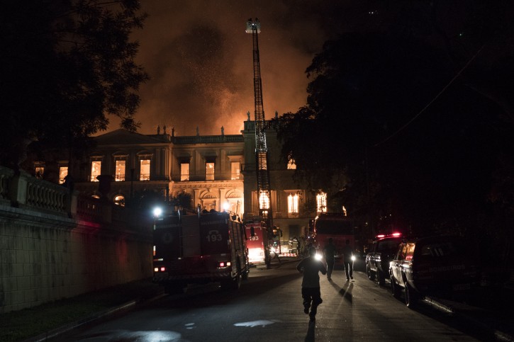 Firefighters work to put out a fire at the 200-year-old National Museum of Brazil, in Rio de Janeiro, Sunday, Sept. 2, 2018. According to its website, the museum has thousands of items related to the history of Brazil and other countries. The museum is part of the Federal University of Rio de Janeiro (AP Photo/Leo Correa)