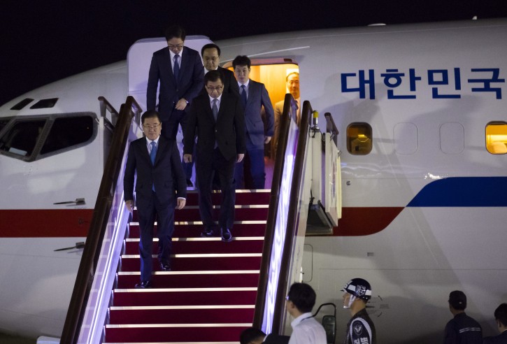 South Korean National Security Advisor Chung Eui-yong, bottom left, National Intelligence Service Director Suh Hoon, bottom second from left, and other delegates return from North Korea at Seoul Airport in Seongnam, South Korea, Wednesday, Sept. 5, 2018. AP