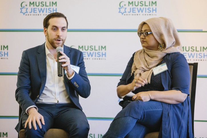 In this May 22, 2018 photo provided by the Muslim Jewish Advisory Council, writers Yair Rosenberg and Rabia Chaudry attend an interfaith Iftar in San Francisco.  (Courtesy the Muslim Jewish Advisory Council via AP)