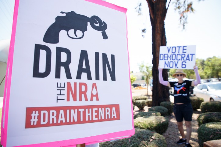 FILE -  A pro-gun control demonstrator holds a sign in opposition to the National Rifle Association (NRA) during a rally and march in Brea, California, USA, 04 August 2018. EPA