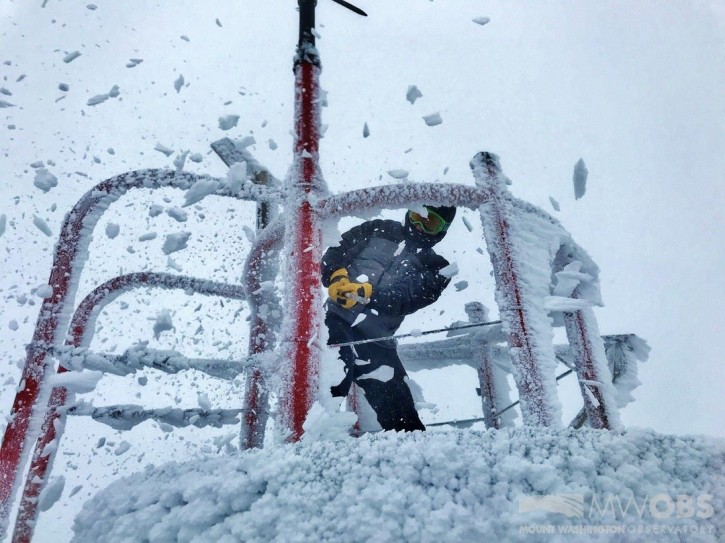 Just another night on Mount Washington! Weather Observer Tom Padham heads outside to de-ice the instrument tower in heavy snow.