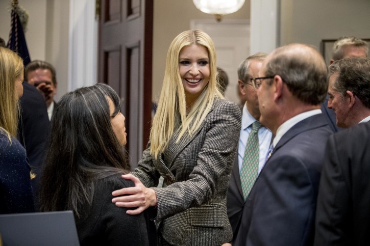FILE - In this Nov. 14, 2018, photo, Ivanka Trump, the daughter of President Donald Trump, center, greets guests after President Donald Trump spoke about prison reform in the Roosevelt Room of the White House in Washington.  AP