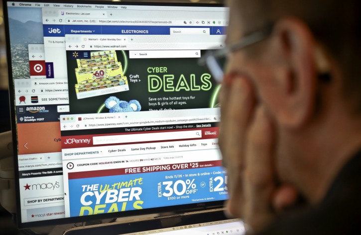 A photo illustration shows websites on a desktop of various online retailers, Monday Nov. 26, 2018, in New York. AP Photo/Bebeto Matthews)