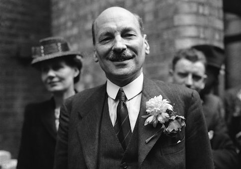 FILE - This is a July 26, 1945 file photo of Labour Party leader Clement Attlee as he smiles at the cheering throngs which gathered at Transport House, in London to celebrate Labour's election victory. AP