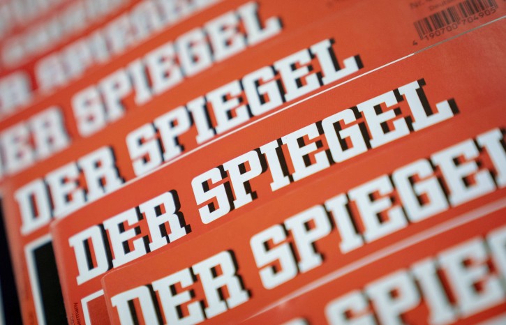 The Dec. 19, 2018 photo shows issues of German news magazine Spiegel arranged on a table in Berlin. An award-winning journalist who worked for Der Spiegel, one of Germanyâs leading news outlet, has left the publication after being found to have committing what the weekly described Wednesday as journalistic fraud âon a grand scaleâ over a number of years. (Kay Nietfeld/dpa via AP)