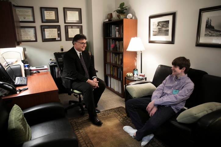 Dr. Chris Tuell, Clinical Director of Addiction Services, poses with Danny Reagan at the Lindner Center of Hope's "Reboot" program, the first of its kind to admit only children who suffer from compulsion or obsession with their use of technology, in Mason, Ohio, U.S., January 23, 2019. REUTERS/Maddie McGarvey