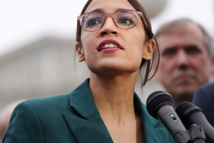 FILE PHOTO: U.S. Representative Alexandria Ocasio-Cortez (D-NY) speaks during a news conference for a proposed "Green New Deal" to achieve net-zero greenhouse gas emissions in 10 years, at the U.S. Capitol in Washington, U.S. February 7, 2019.  REUTERS/Jonathan Ernst/File Photo