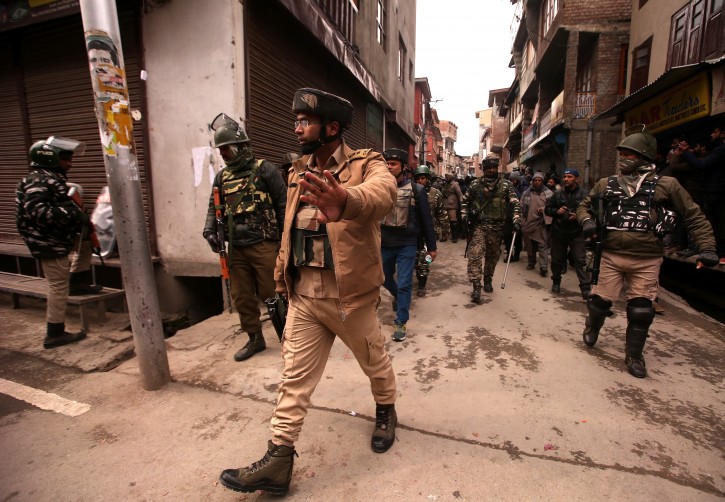 Indian Central Reserve Police Force (CRPF) officers escort National Investigation Agency (NIA) members as they leave after carrying out a raid at the residence of Yasin Malik, Chairman of Jammu Kashmir Liberation Front (JKLF), a separatist party, in Srinagar February 26, 2019. REUTERS/Danish Ismail