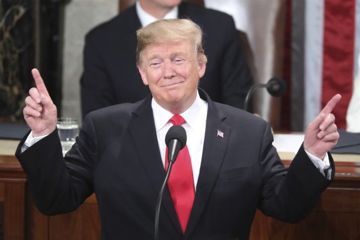 President Donald Trump gestures as a conductor as people in the chamber sing "Happy Birthday" to Judah Samet as he delivers his State of the Union address to a joint session of Congress on Capitol Hill in Washington, Tuesday, Feb. 5, 2019. Same turned 81 on Tuesday. (AP Photo/Andrew Harnik)