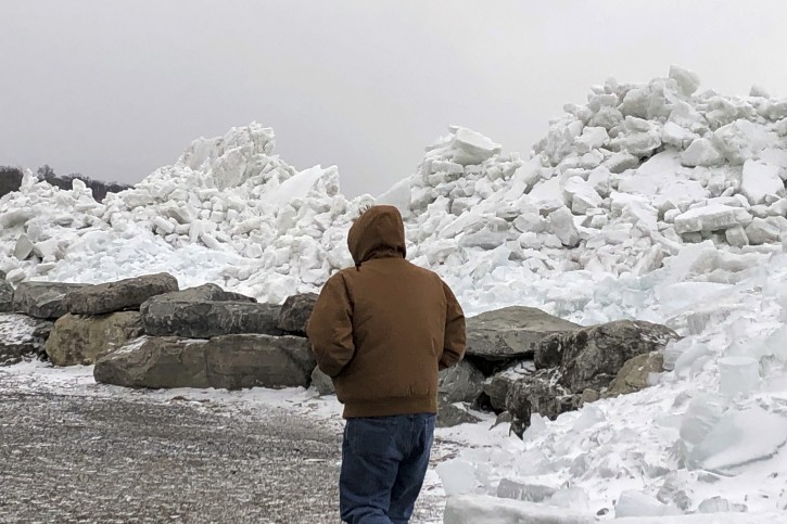 Mounds of ice collect along the Lake Erie shore at Hoover Beach, in Hamburg, N.Y., Monday, Feb. 25, 2019. High winds howled through much of the nation's eastern half for a second day Monday, cutting power to hundreds of thousands of homes and businesses, closing schools, and pushing dramatic mountains of ice onto the shores of Lake Erie. (AP Photo/Carolyn Thompson)