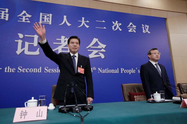 Chinese Commerce Minister Zhong Shan (L) and Vice Commerce Minister, Deputy China International Trade Representative Wang Shouwen arrive for a news conference during the ongoing session of the National People's Congress (NPC) in Beijing, China March 9, 2019. REUTERS/Jason Lee