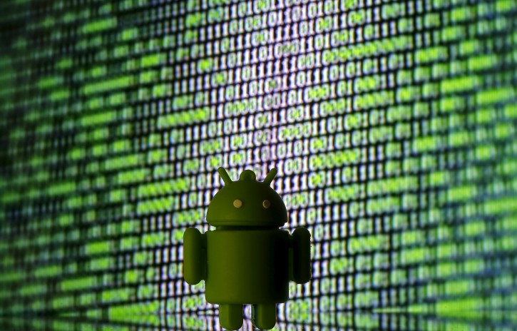 3D printed Android logo is seen in front of a displayed cyber code A 3D printed Android logo is seen in front of a displayed cyber code in this illustration taken March 22, 2016. REUTERS/Dado Ruvic/Illustration