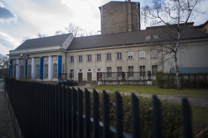 In this Wednesday, March 20, 2019 photo, a fence protects the so-called youth-synagogue, the remaining building of the 'Fraenkelufer' synagogue, in Berlin. The synagogue was able to receive about 2000 prayers before it was destroyed by the Nazis. In the German capital, efforts are underway to rebuild the synagogue.  (AP Photo/Markus Schreiber)