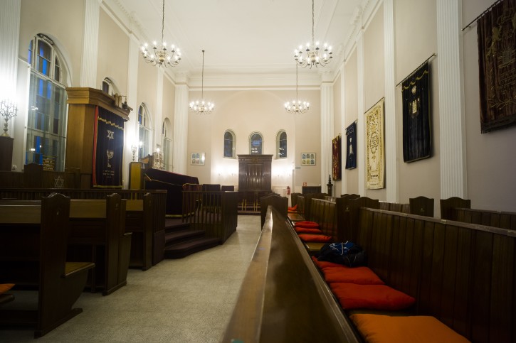 This Wednesday, March 20, 2019 photo shows a view inside the prayer room of the so-called youth-synagogue, the remaining building of the 'Fraenkelufer' synagogue, in Berlin. The synagogue was able to receive about 2000 prayers before it was destroyed by the Nazis. In the German capital, efforts are underway to rebuild the synagogue.  (AP Photo/Markus Schreiber)