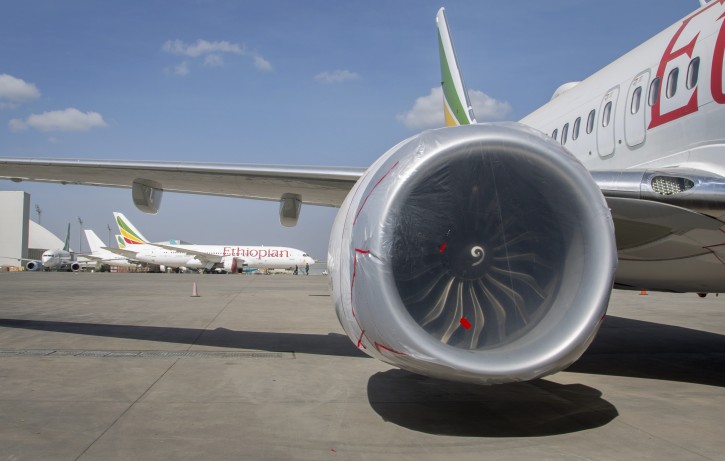 Other Ethiopian Airlines aircraft are seen in the distance behind an Ethiopian Airlines Boeing 737 Max 8 as it sits grounded at Bole International Airport in Addis Ababa, Ethiopia Saturday, March 23, 2019. The chief of Ethiopian Airlines says the warning and training requirements set for the now-grounded 737 Max aircraft may not have been enough following the Ethiopian Airlines plane crash that killed 157 people. (AP Photo/Mulugeta Ayene)