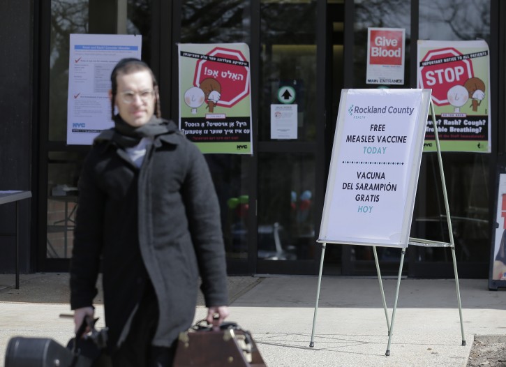 Signs about measles and the measles vaccine are displayed at the Rockland County Health Department in Pomona, N.Y., Wednesday, March 27, 2019.
