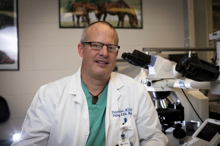 This April 25, 2019 photo provided by the University of Kentucky shows Dr. Peter Nelson of the Sanders-Brown Center on Aging in Lexington, Ky. On Tuesday, April 30, scientists, including lead author Nelson, released results showing a buildup of an abnormal protein named TDP-43 sometimes causes dementia, especially in the oldest-old. (Pete Comparoni/University of Kentucky via AP)