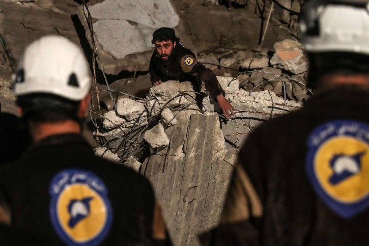  (FILE) - Volunteers of White Helmets search for survivors after an explosion in the city of Idlib, Syria, 09 April 2018, (reissued 22 July 2018). EPA