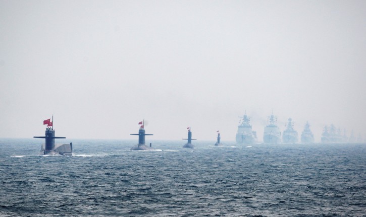 FILE PHOTO: Chinese Navy submarines and warships take part in an international fleet review to celebrate the 60th anniversary of the founding of the People's Liberation Army Navy in Qingdao, Shandong province, April 23, 2009. Guang Niu/Pool via REUTERS/File Photo