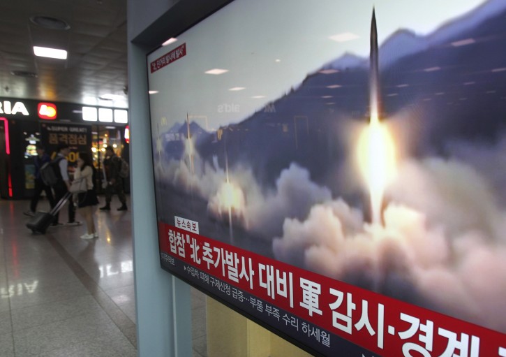 A TV screen shows a file footage of North Korea's missile launch during a news program at the Seoul Railway Station in Seoul, South Korea, Saturday, May 4, 2019. AP