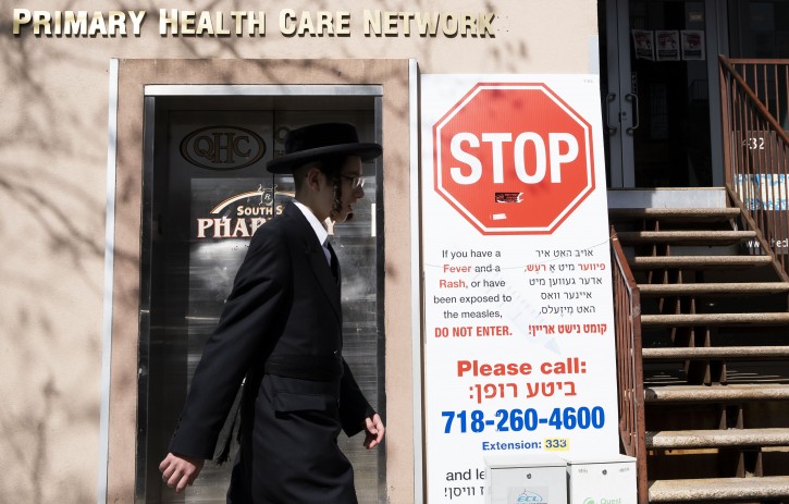 Measles Ourbreak in New York FILE - A man walks past a sign outside of health clinic with warnings about measles in the Williamsburg neighborhood in Brooklyn, New York, USA, 25 April 2019. EPA
