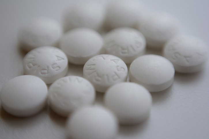 FILE - This Thursday, Aug. 23, 2018 file photo shows an arrangement of aspirin pills in New York. A new study suggests millions of people need to rethink their use of aspirin to prevent a heart attack. If you've already had a heart attack, doctors recommend taking a low-dose aspirin a day to prevent a second one. But if you don't yet have heart disease, doctors now advise routine aspirin can do more harm than good. (AP Photo/Patrick Sison, File)