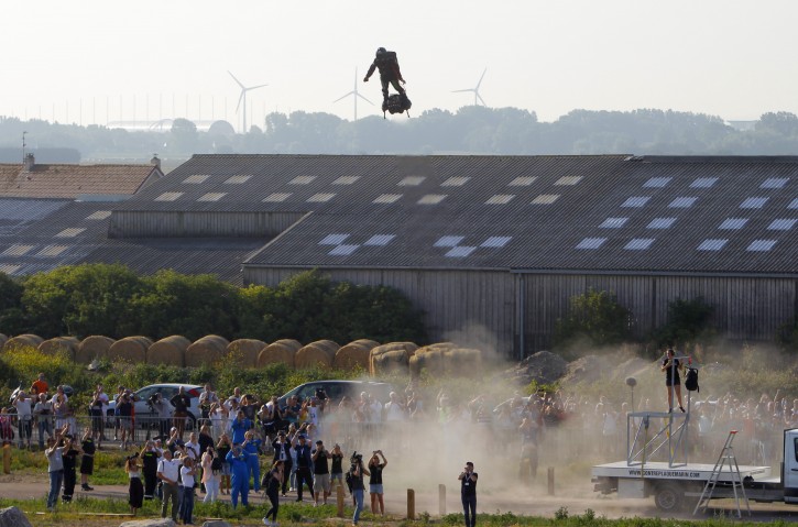 Franky Zapata, a 40-year-old inventor, takes to the air in Sangatte, Northern France, at the the start of his attempt to cross the channel Thursday July 25, 2019. (AP Photo/Michel Spingler)