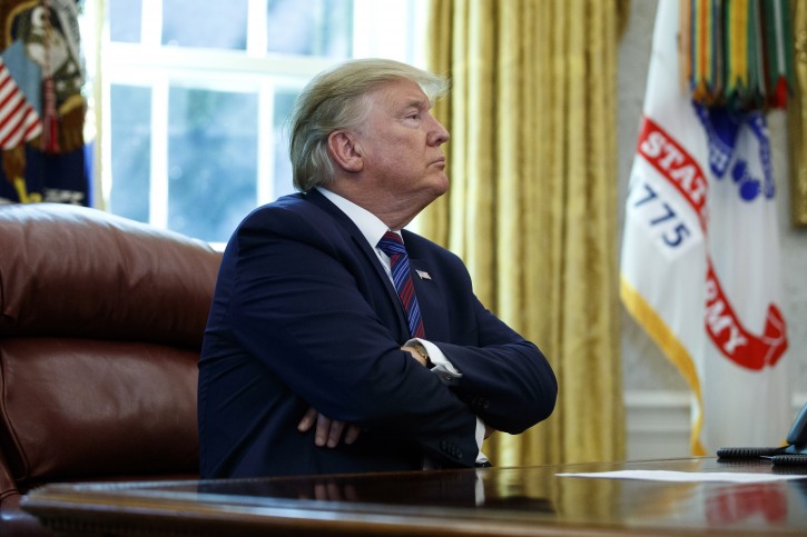 President Donald Trump pauses as he speaks in the Oval Office of the White House in Washington, Friday, July 26, 2019. AP
