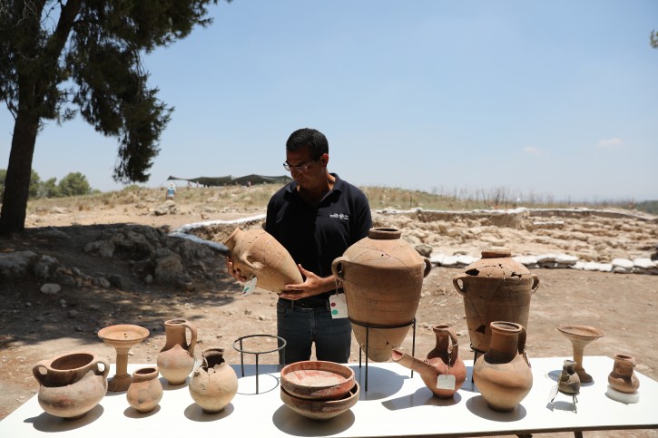 Israeli archaeologist Saar Gabor of the Israel Antiquities Authority presents the archaeological findings at the archaeological site near the city of Kiryat Gat, southern Israel, 08 July 2019.EPA